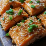 Exploring the culinary world can be a delightful journey, especially when it comes to creating dishes that are both easy to prepare and bursting with flavor. One such dish that fits this description is Crispy Honey Garlic Salmon Bites. This recipe combines the richness of salmon with a sweet and savory glaze, making it a perfect appetizer or main dish. The crispy exterior, paired with the sticky honey garlic sauce, tantalizes the taste buds and offers a satisfying crunch with every bite.