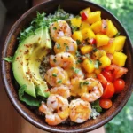 If you're on the lookout for a meal that is as nutritious as it is delicious, look no further than Shrimp and Avocado Bowls with Mango Salsa and Lime-Chili Sauce. This vibrant dish is a delightful celebration of fresh, tropical flavors that not only tantalizes your taste buds but also packs in a wealth of nutrients. The combination of succulent shrimp, creamy avocado, and zesty mango salsa makes this recipe a perfect fit for anyone seeking a quick, healthy meal option that doesn't skimp on flavor.