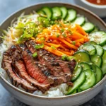 In recent years, Korean cuisine has captivated food lovers around the world, and one dish that stands out is the Korean BBQ steak rice bowl. This vibrant dish showcases a delightful combination of tender, marinated flank steak, fluffy jasmine rice, and an array of fresh vegetables. Each component not only contributes to the dish's aesthetic appeal but also plays a crucial role in creating a harmonious balance of flavors and textures. The addition of a spicy cream sauce elevates this classic dish, making it the perfect option for both weeknight dinners and weekend gatherings.
